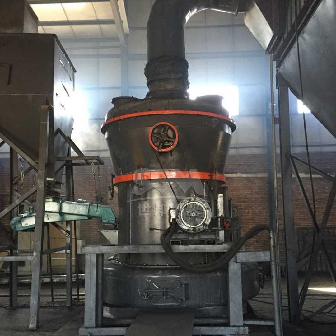 Large industrial grinding mill installed in a mineral processing plant